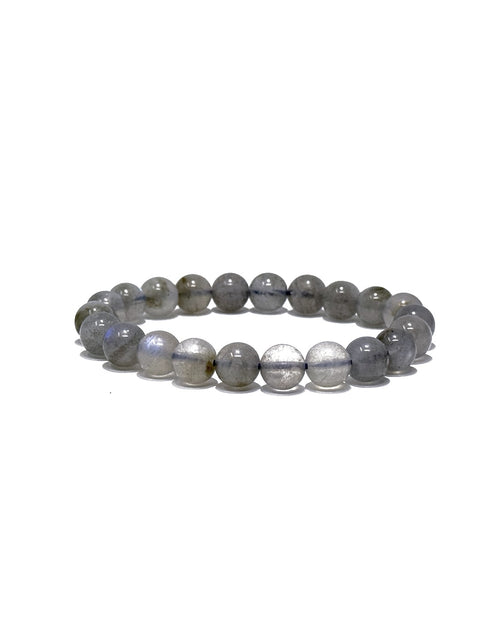 A beaded stretch bracelet made of polished gray stone beads with a subtle iridescent sheen, displayed on a clean white background.